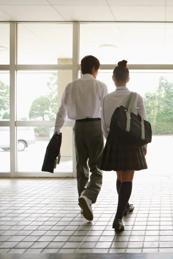 Two students walking Asia